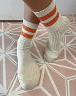 Her socks varsity orange